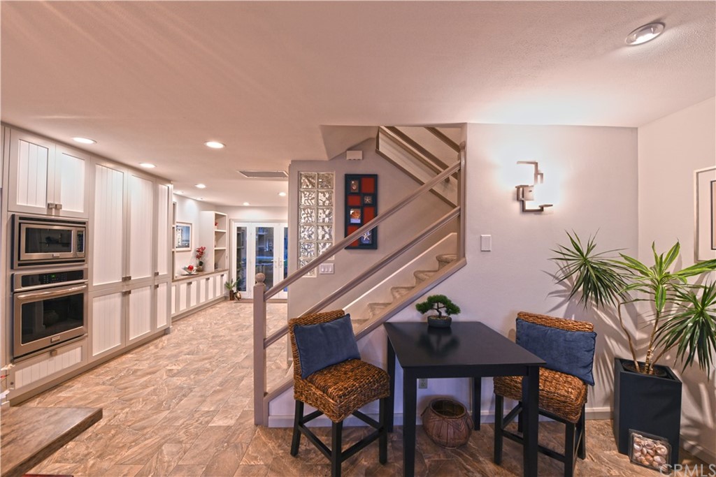 106 Blue Lagoon Laguna Beach, CA 92651 - Photo 13 of 46 a dinning room with furniture and wooden floor