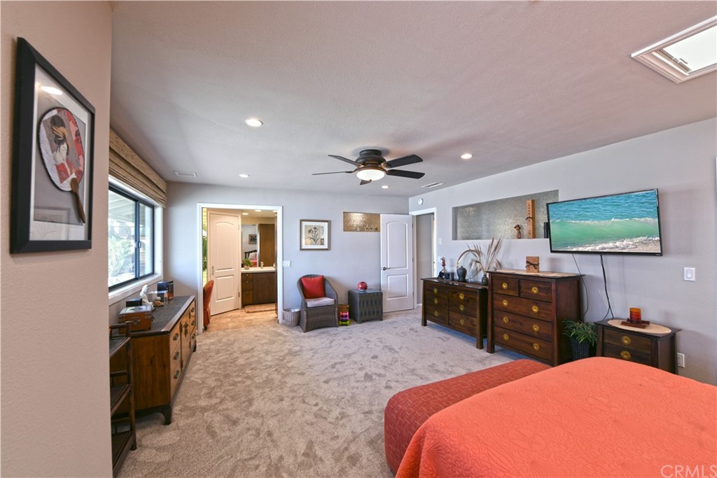 106 Blue Lagoon Laguna Beach, CA 92651 - Photo 19 of 46 a bed room with a bed and furniture