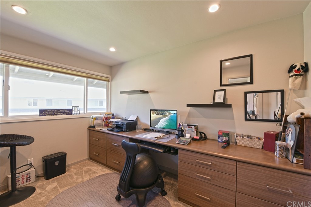 106 Blue Lagoon Laguna Beach, CA 92651 - Photo 25 of 46 a kitchen with granite countertop a sink cabinets and window