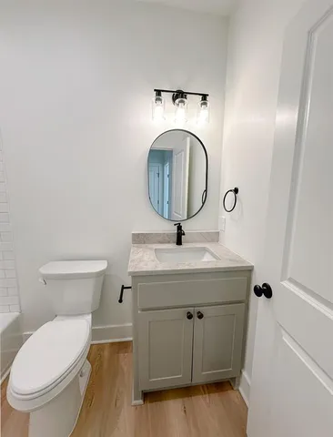 a bathroom with a toilet and a bathtub