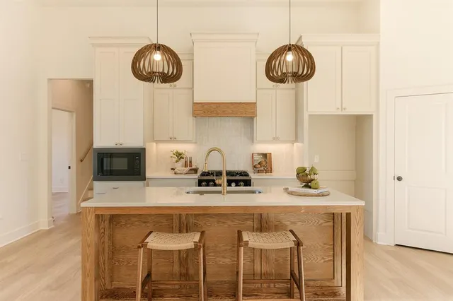 a living room with a fireplace and a walk in closet