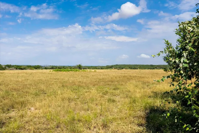 a view of lake with green space