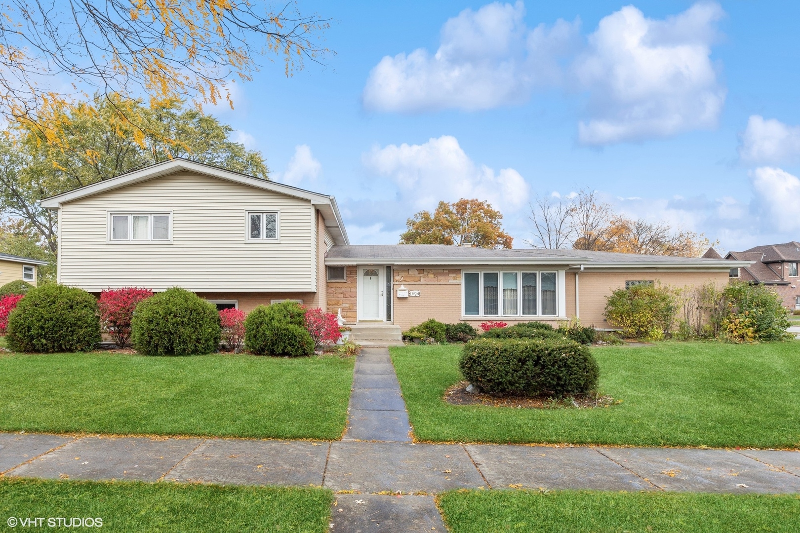 7604 Beckwith Road Morton Grove, IL 60053 - Photo 1 of 20 a front view of a house with a garden