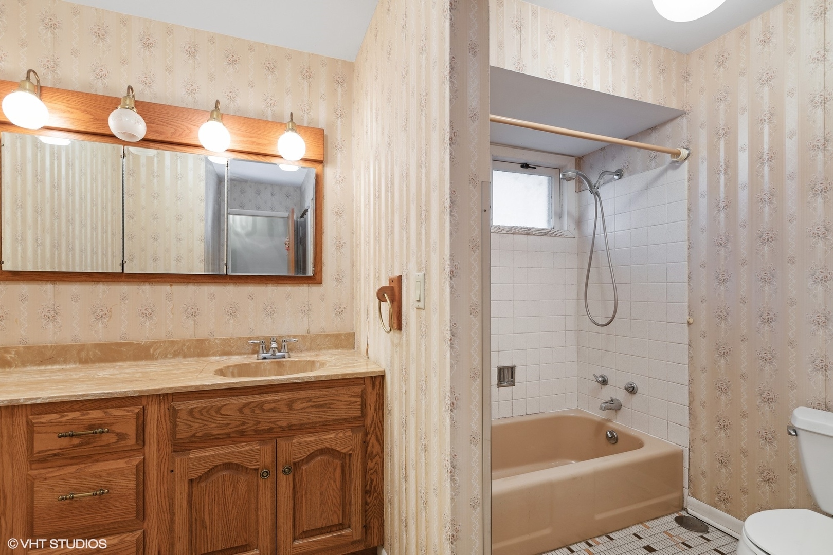 7604 Beckwith Road Morton Grove, IL 60053 - Photo 11 of 20 a bathroom with a granite countertop sink toilet and shower