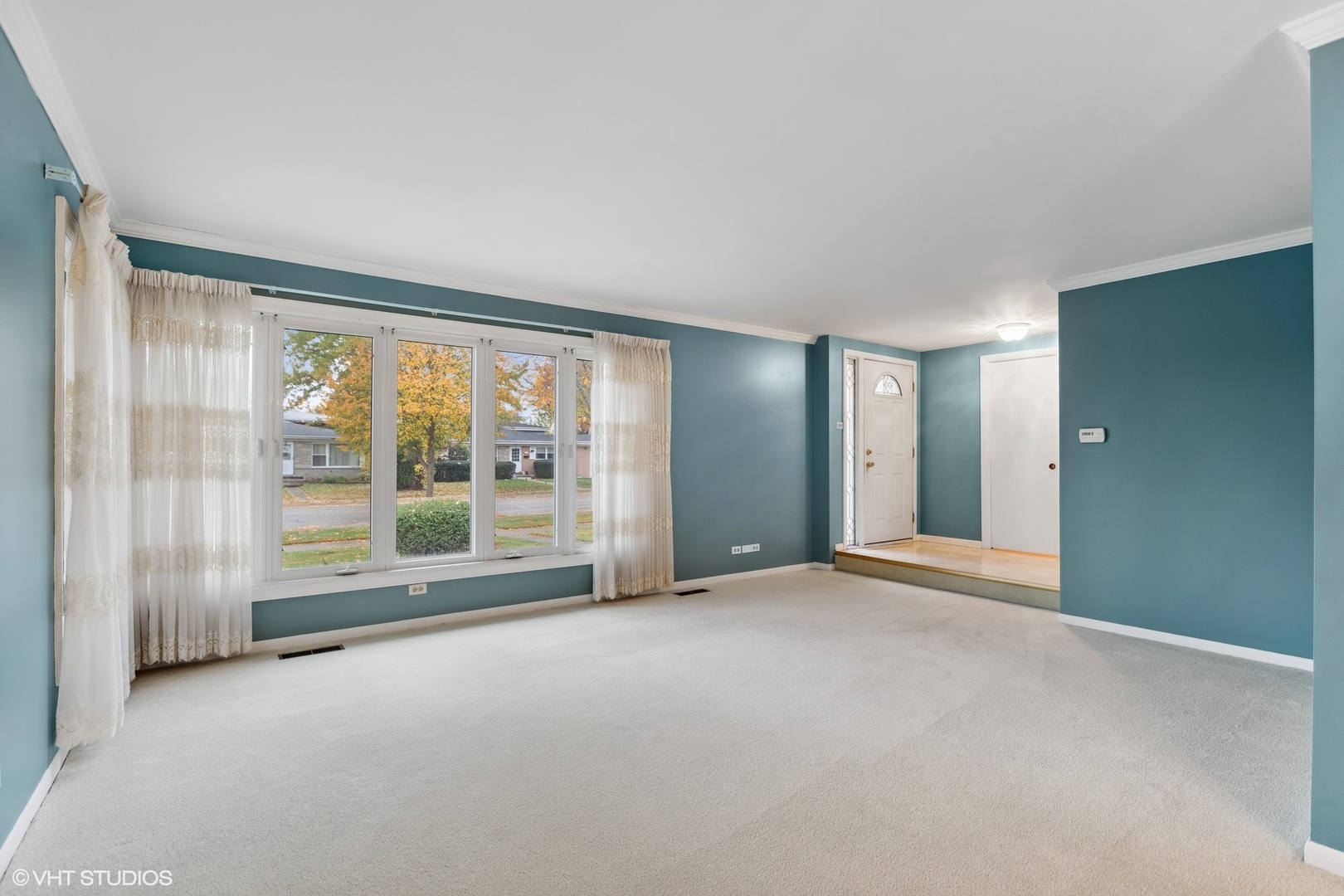 7604 Beckwith Road Morton Grove, IL 60053 - Photo 2 of 20 an empty room with floor to ceiling window and an outdoor view