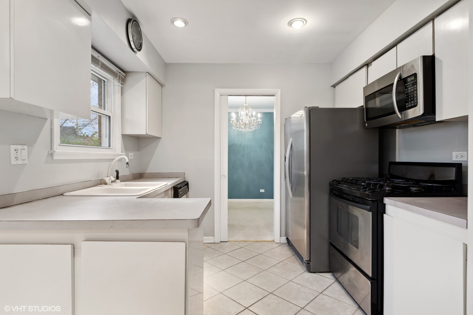 7604 Beckwith Road Morton Grove, IL 60053 - Photo 5 of 20 a kitchen with stainless steel appliances granite countertop a sink stove and refrigerator