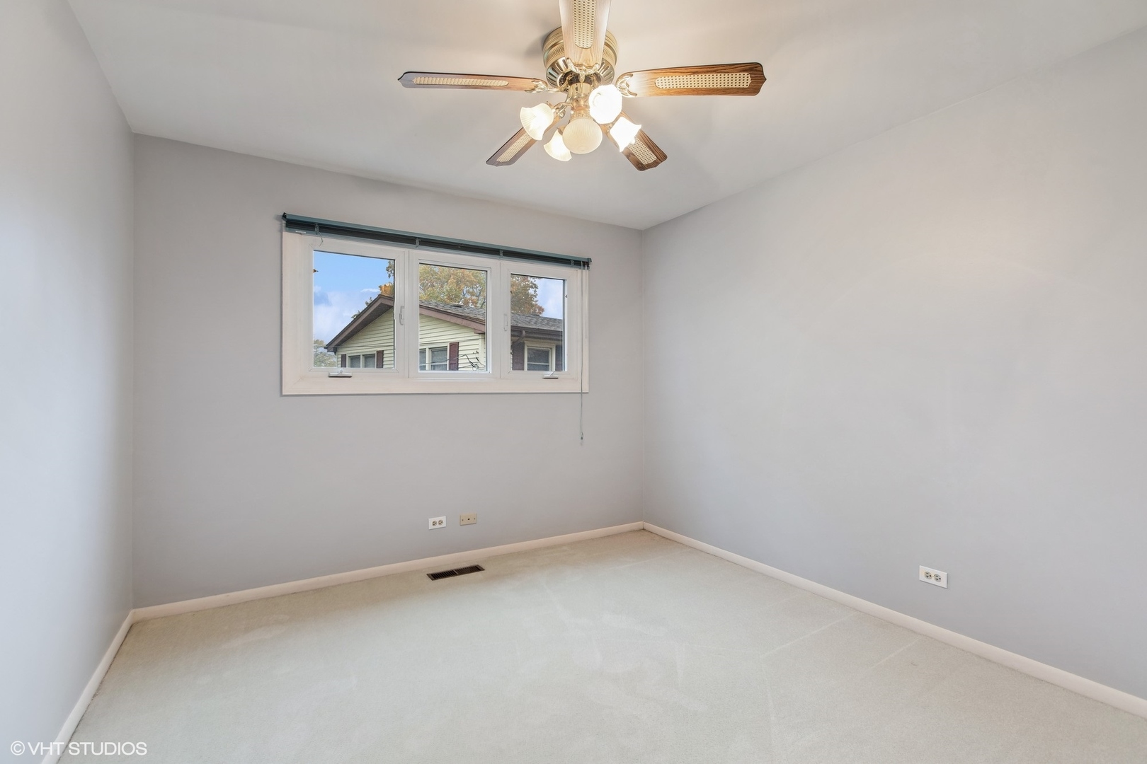 7604 Beckwith Road Morton Grove, IL 60053 - Photo 6 of 20 an empty room with a window and a fan