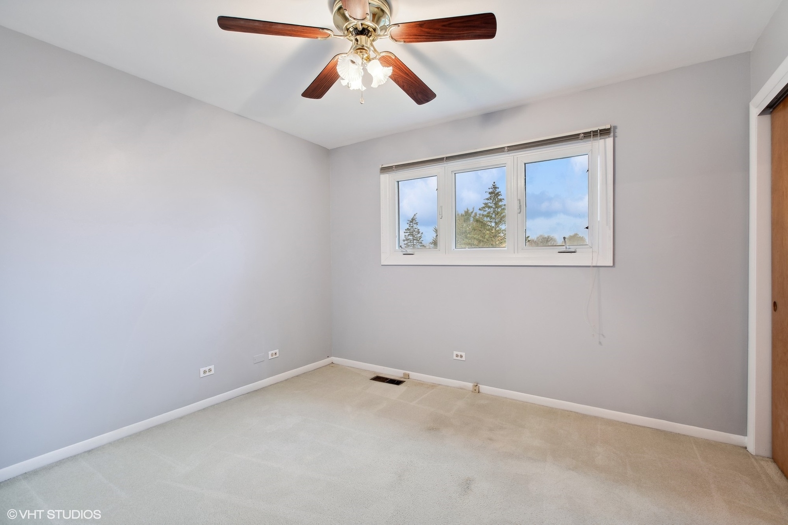 7604 Beckwith Road Morton Grove, IL 60053 - Photo 8 of 20 an empty room with a window and a fan