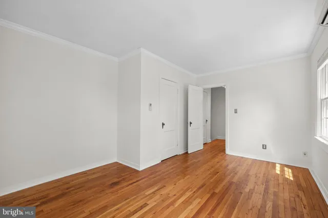 a view of a room with wooden floor