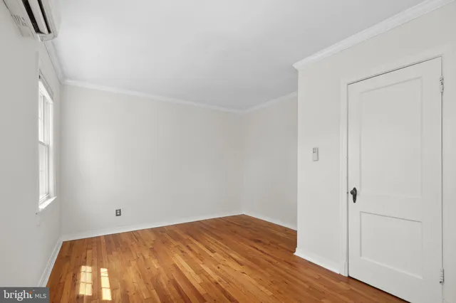 a view of a room with wooden floor and small space
