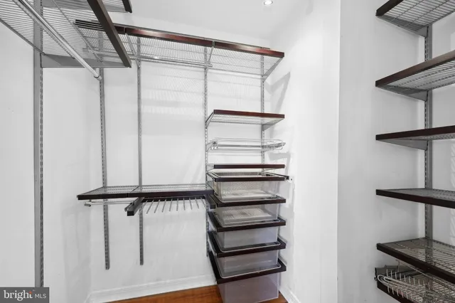 a view of staircase with white walls and a window