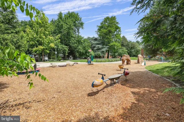 a view of a park with swings and slides