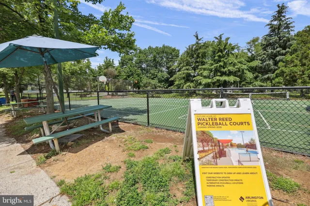 a view of a park with swings and slides