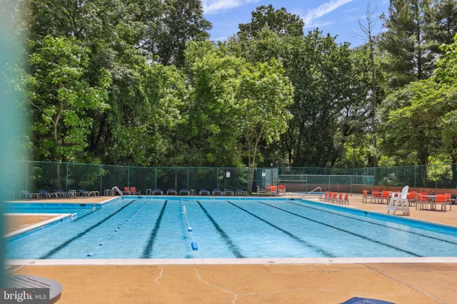 a view of swimming pool with chairs
