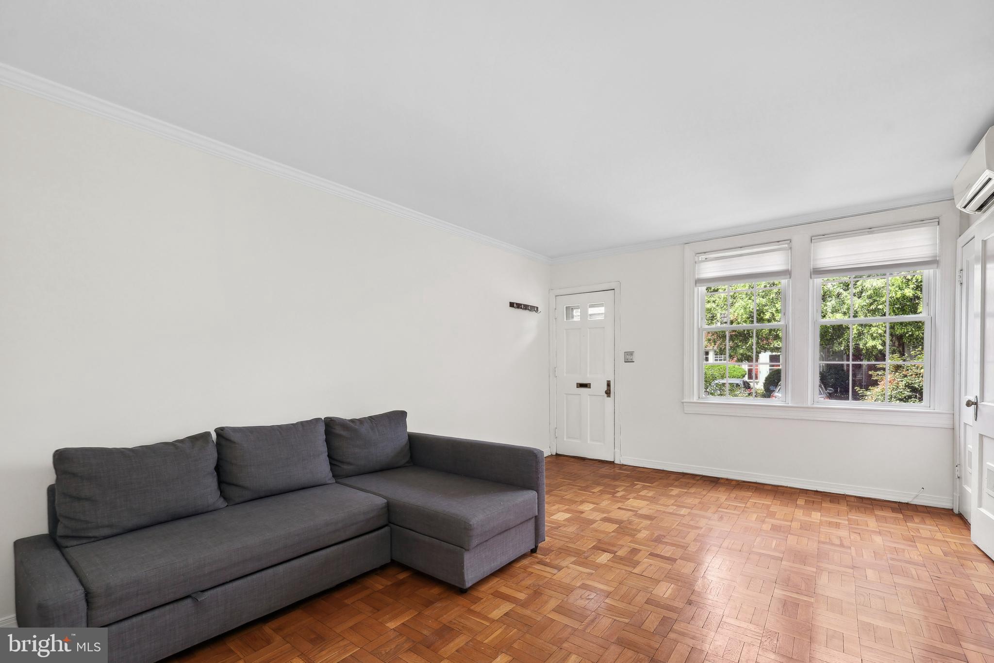 2600 16th Street South, Unit 711 Arlington, VA 22204 - Photo 6 of 27 a living room with furniture and a window