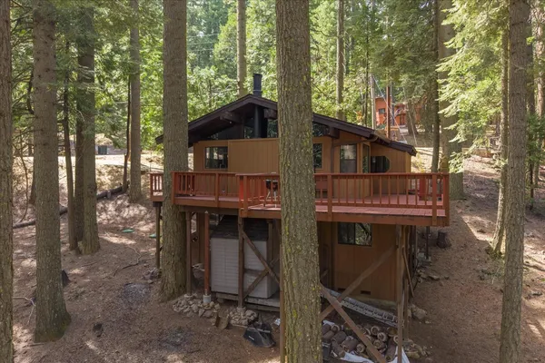 a view of a lush green hillside and a mountain view