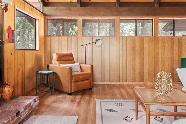 a living room with furniture a table and chairs