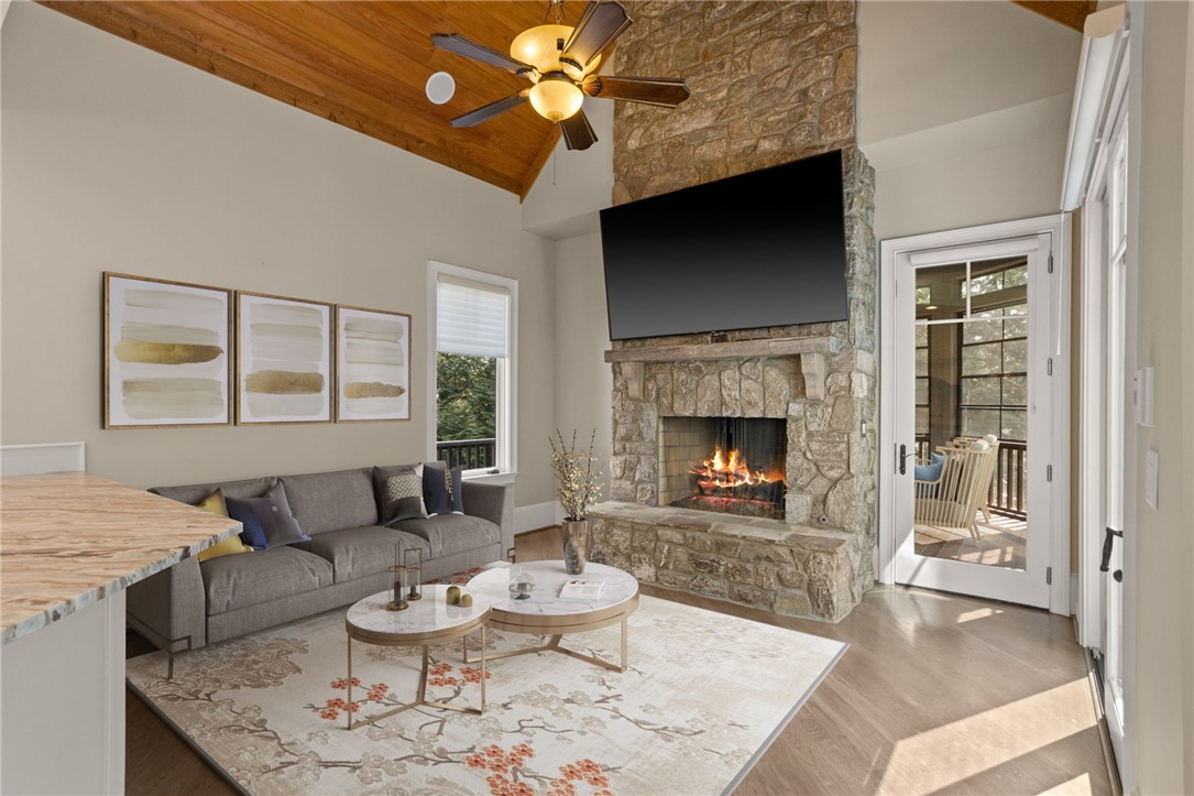 314 Palmer Way Sunset, SC 29685 - Photo 11 of 48 An impressive stone fireplace rises to meet the vaulted wood ceiling in this living room.