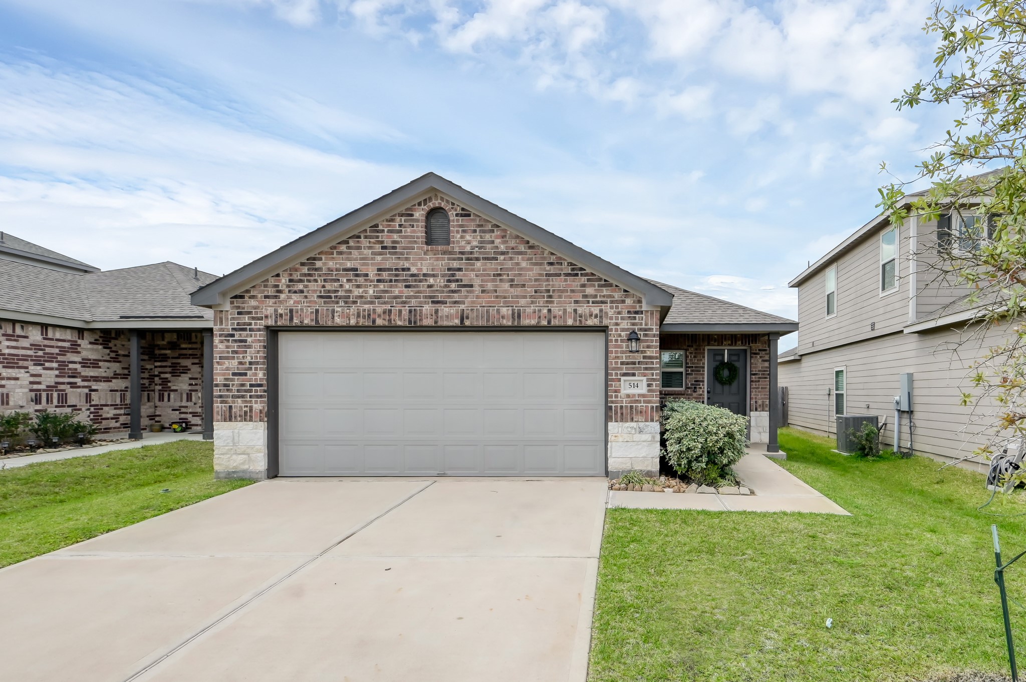 514 Dalloway Street Conroe, TX 77316 - Photo 2 of 27 Charming brick exterior with covered entry and attached two-car garage