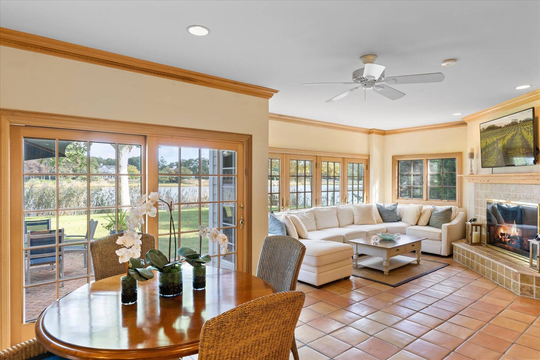 25 Quantuck Bay Lane Westhampton Beach, NY 11978 - Photo 14 of 38 a living room with furniture and a floor to ceiling window