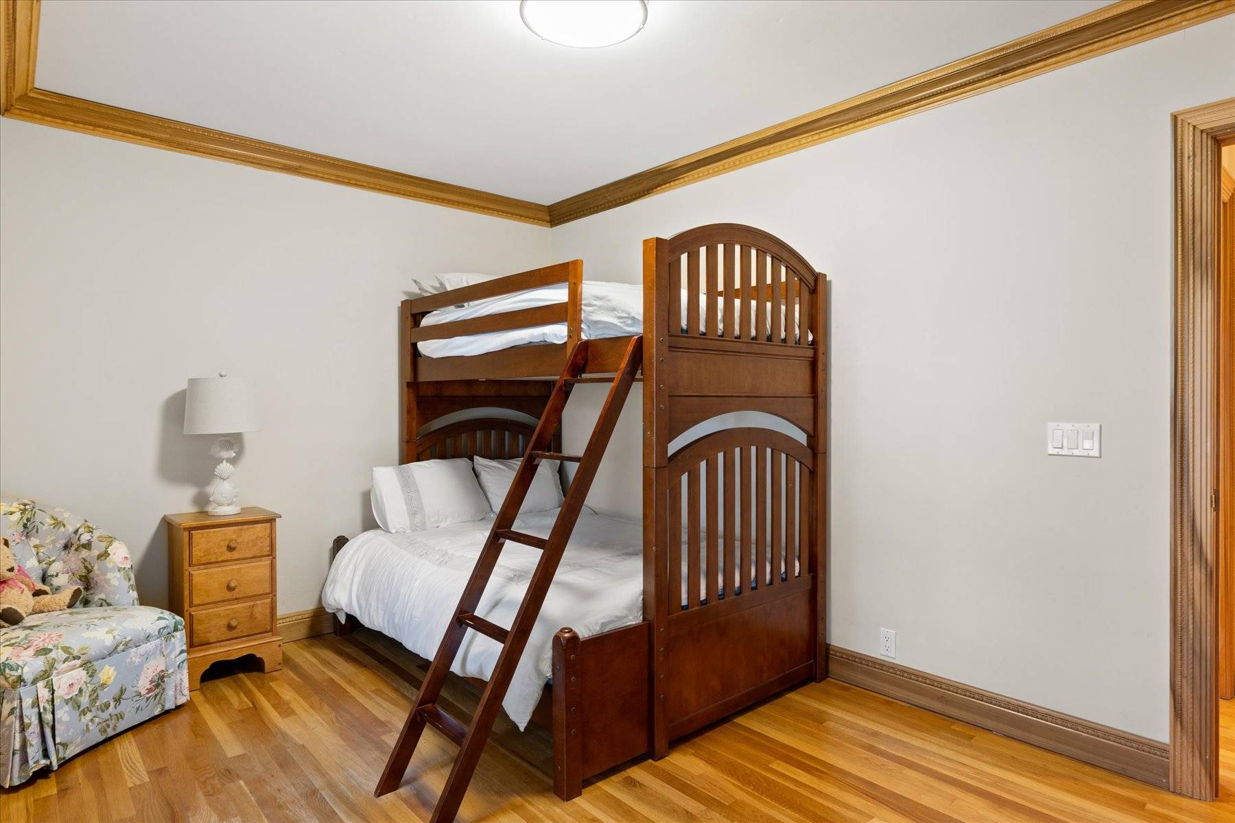 25 Quantuck Bay Lane Westhampton Beach, NY 11978 - Photo 22 of 38 a bedroom with a bed and wooden floor