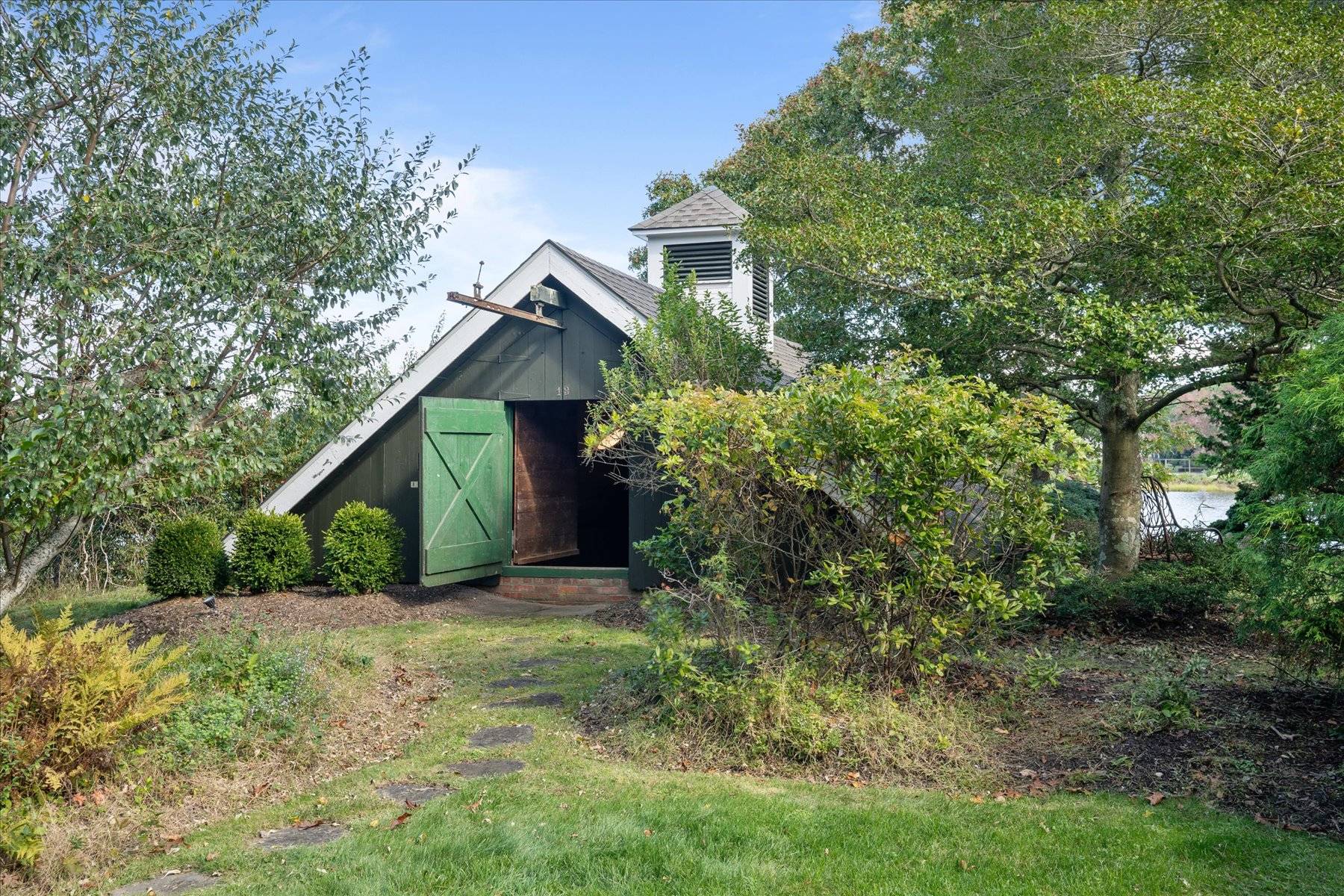 25 Quantuck Bay Lane Westhampton Beach, NY 11978 - Photo 29 of 38 a view of a house with a yard and plants