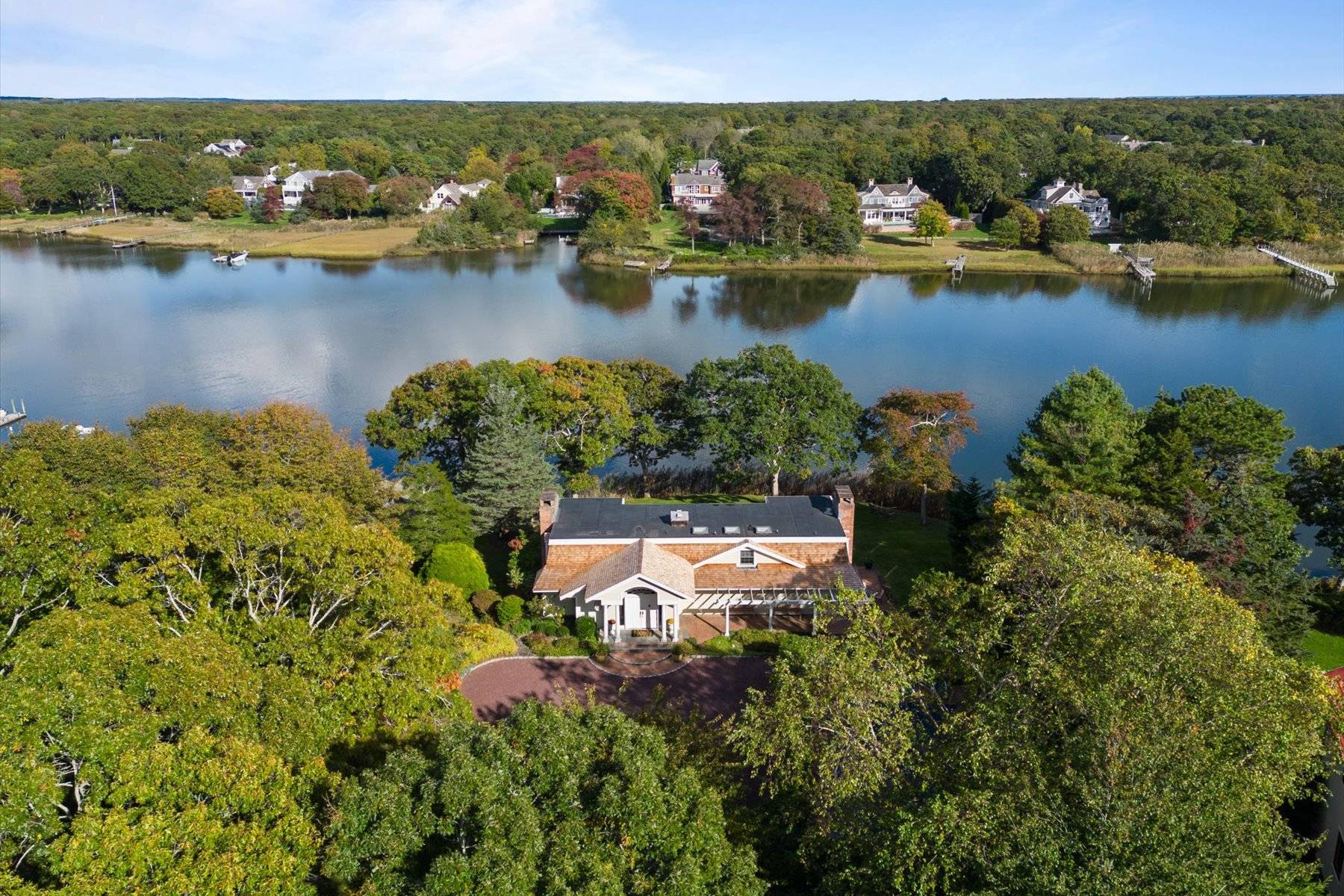 25 Quantuck Bay Lane Westhampton Beach, NY 11978 - Photo 3 of 38 an aerial view of a house with a lake view