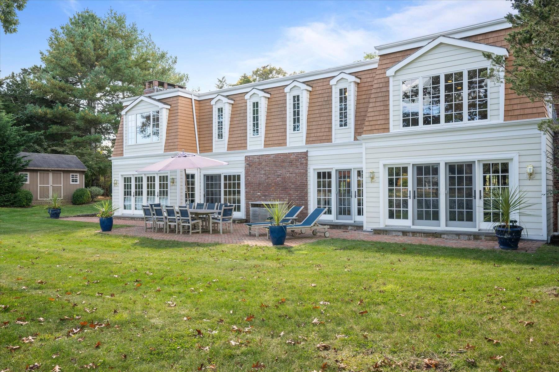 25 Quantuck Bay Lane Westhampton Beach, NY 11978 - Photo 36 of 38 a view of a house with a yard and sitting area