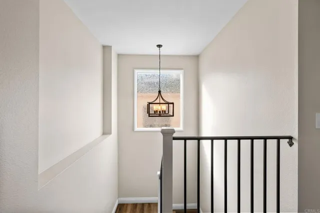 a view of a hallway with windows