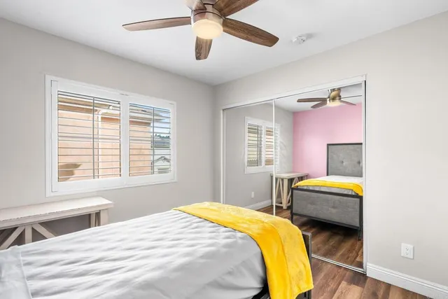 a bedroom with a bed and a couch