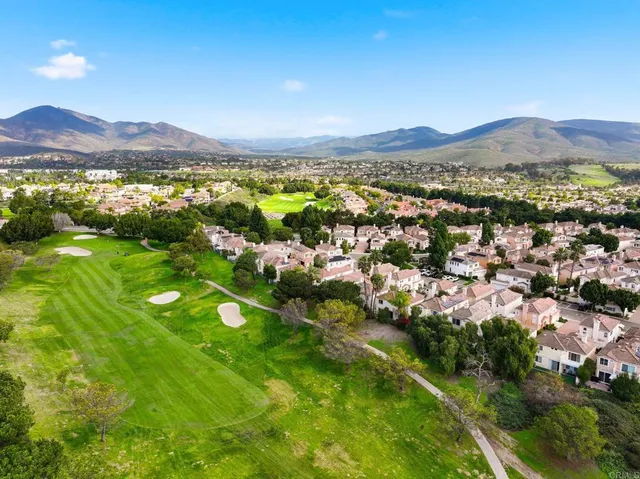 a view of a city with mountains in the background