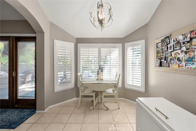 a kitchen with stainless steel appliances granite countertop a refrigerator sink and stove