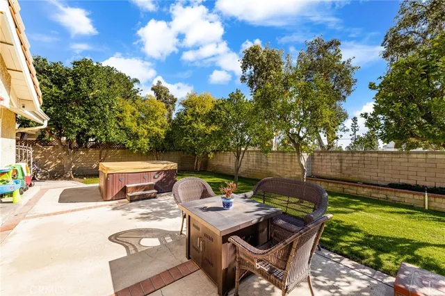 a view of a backyard with sitting area