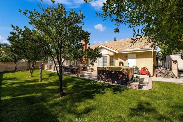 an aerial view of a house with garden space and street view