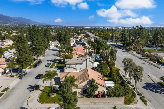 an aerial view of residential house with outdoor space and mountain view