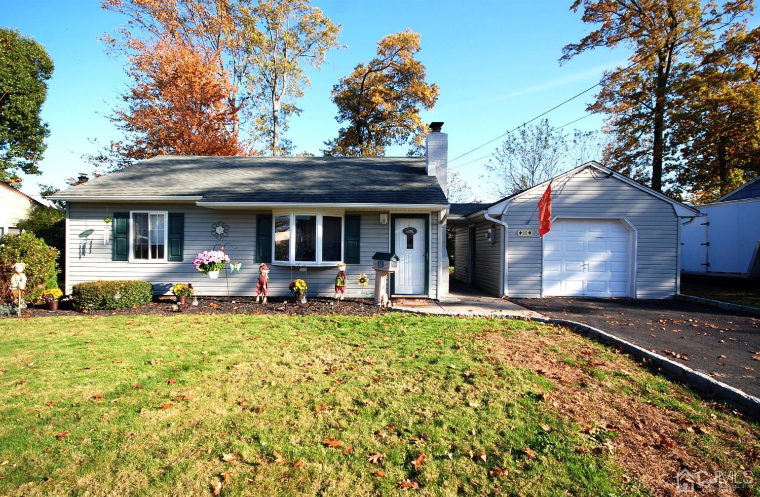 18 Crescent Road Edison, NJ 08817 - Photo 1 of 28 a view of a house with backyard porch and sitting area