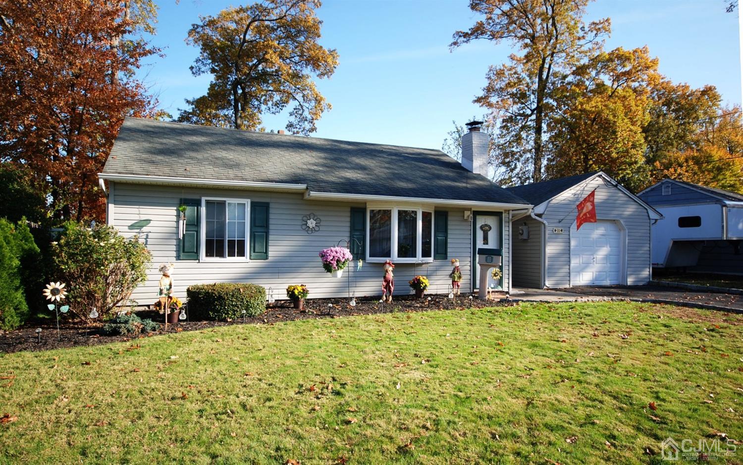 18 Crescent Road Edison, NJ 08817 - Photo 2 of 28 a view of a house with sitting area and garden