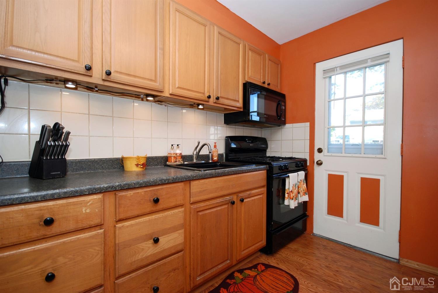 18 Crescent Road Edison, NJ 08817 - Photo 11 of 28 a kitchen with stainless steel appliances granite countertop a sink a stove and cabinets