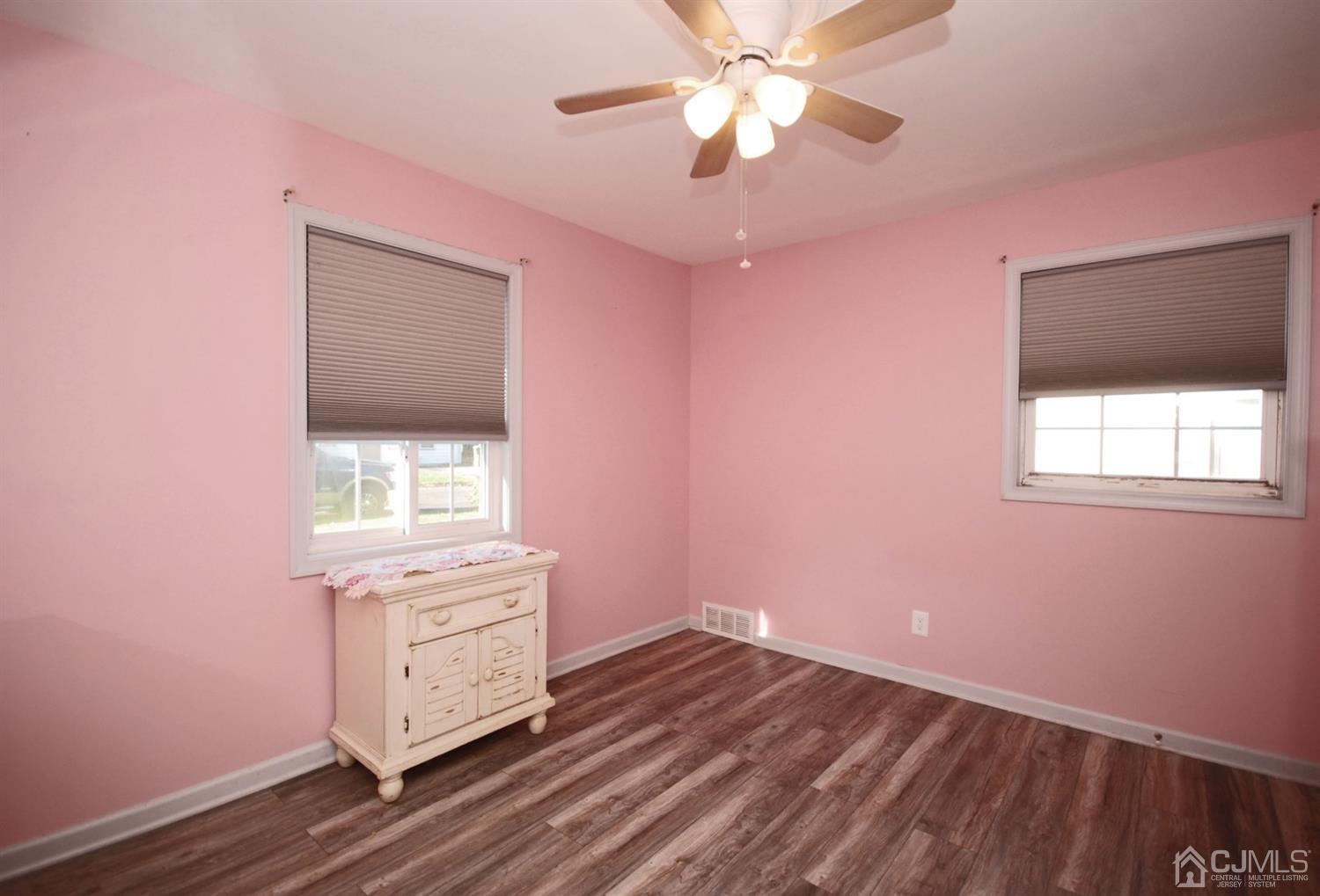 18 Crescent Road Edison, NJ 08817 - Photo 15 of 28 a view of a livingroom with a fan and a window