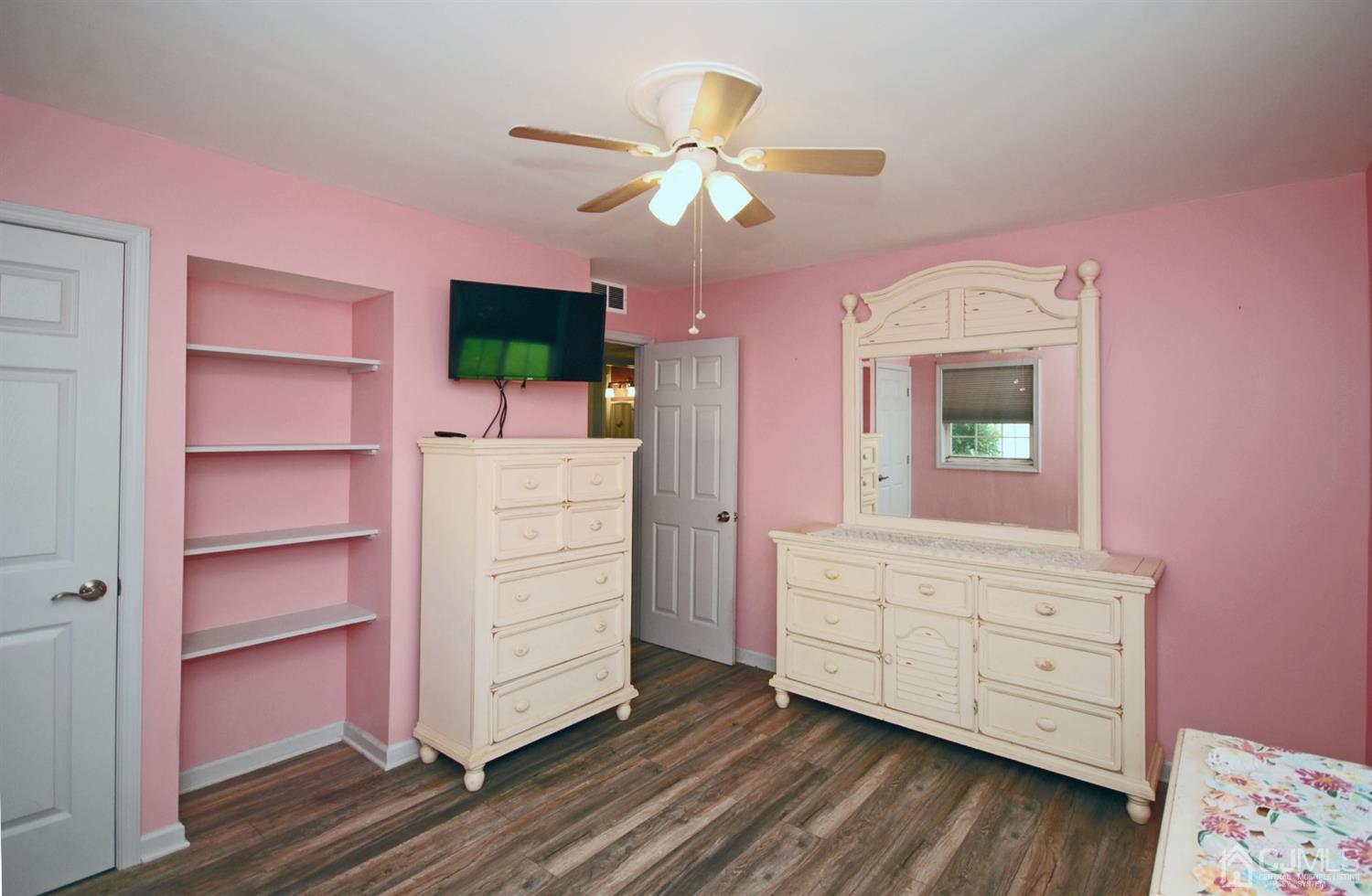18 Crescent Road Edison, NJ 08817 - Photo 16 of 28 a living room with furniture and a dresser