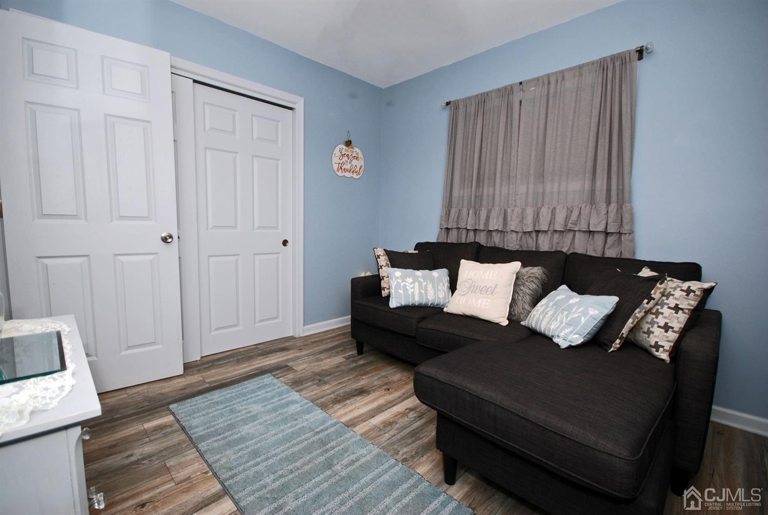 18 Crescent Road Edison, NJ 08817 - Photo 17 of 28 a living room with furniture and wooden floor