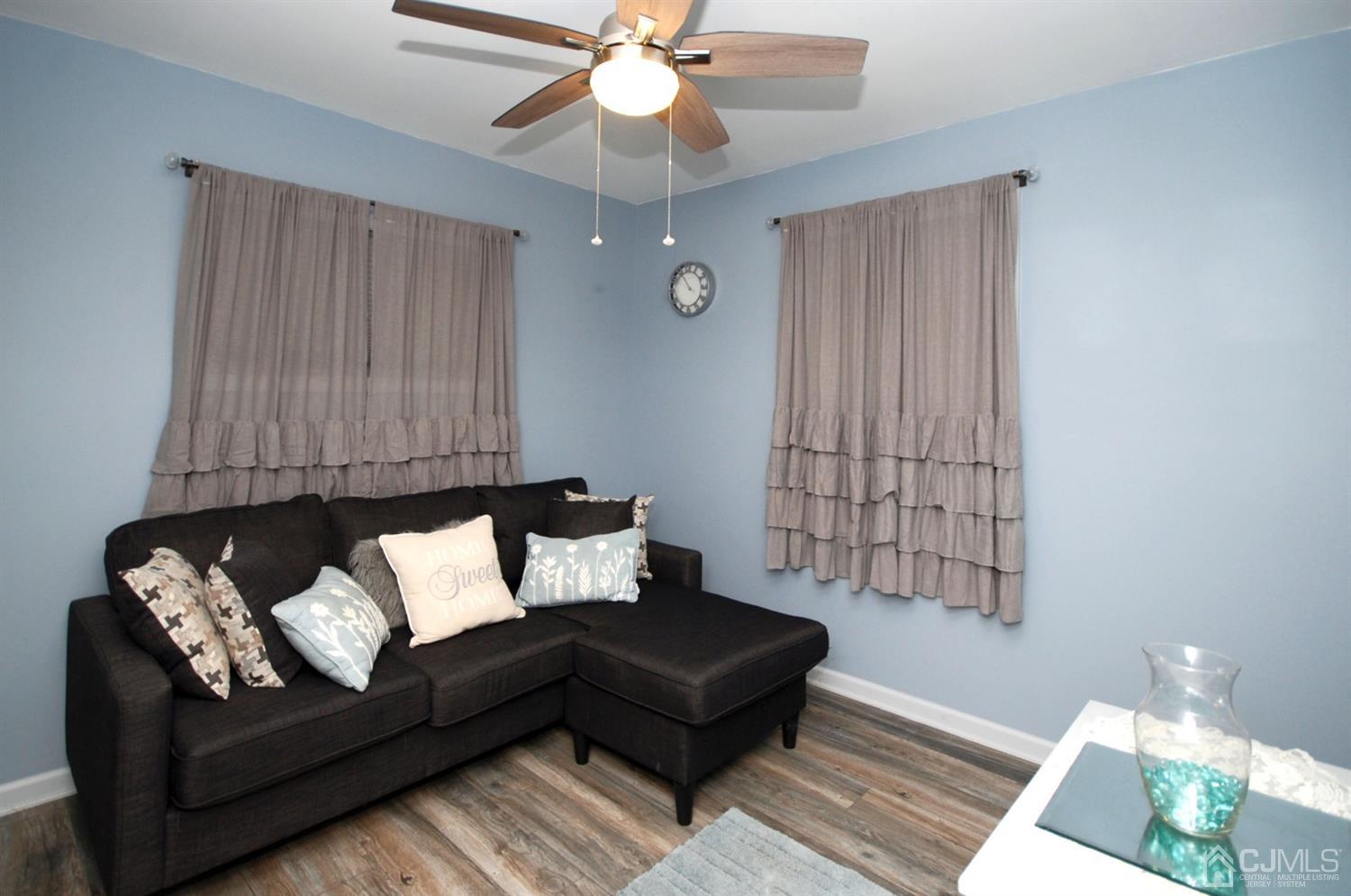 18 Crescent Road Edison, NJ 08817 - Photo 18 of 28 a living room with furniture and a ceiling fan