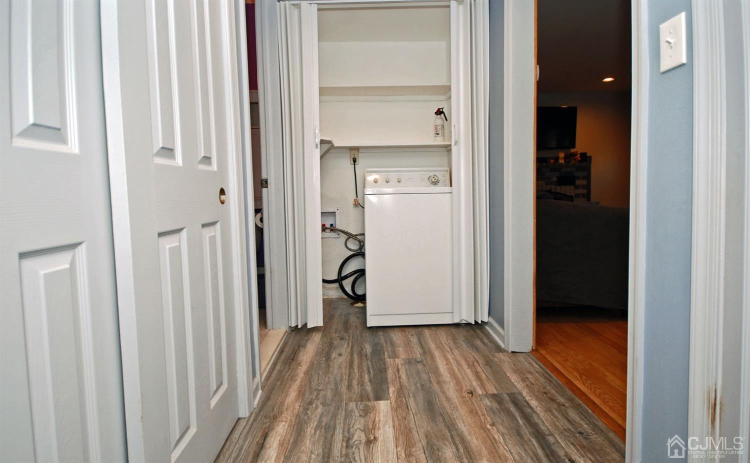 18 Crescent Road Edison, NJ 08817 - Photo 20 of 28 a view of a hallway with wooden floor and closet