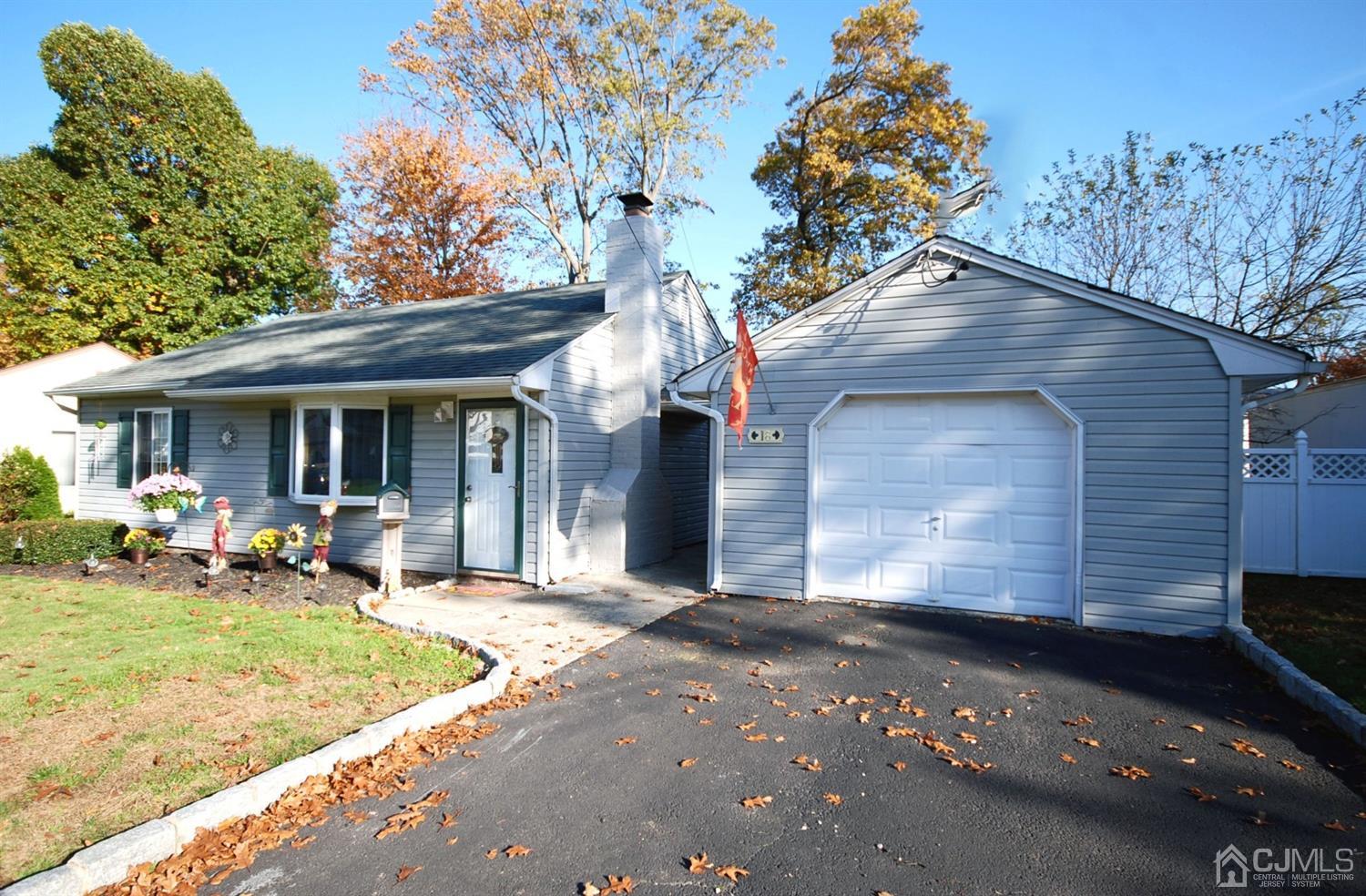18 Crescent Road Edison, NJ 08817 - Photo 3 of 28 a front view of a house with a yard and garage