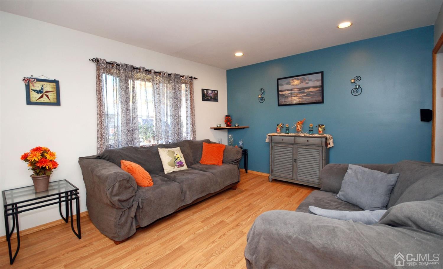 18 Crescent Road Edison, NJ 08817 - Photo 7 of 28 a living room with furniture and a window
