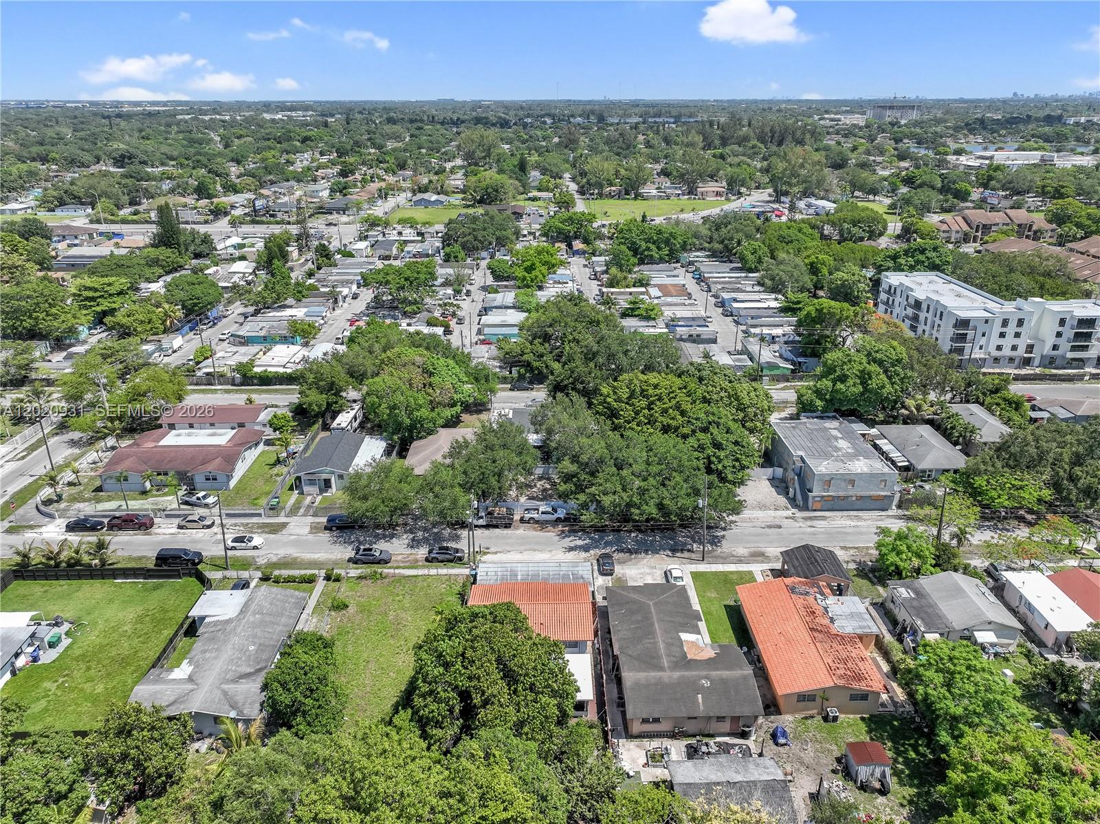 1360 Northwest 77th Street Miami, FL 33147 - Photo 38 of 41 an aerial view of residential houses with outdoor space and swimming pool
