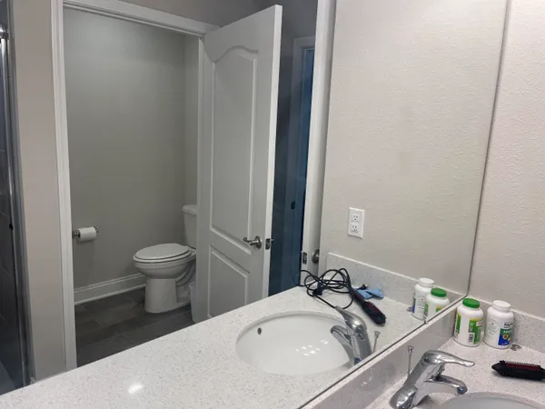 a bathroom with a sink and a toilet
