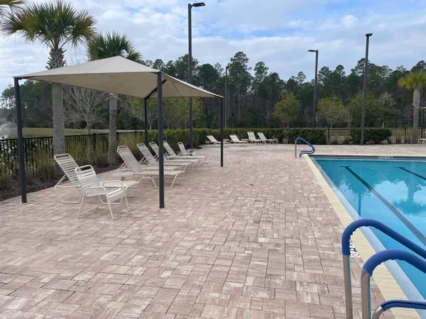 a view of a swimming pool with a patio