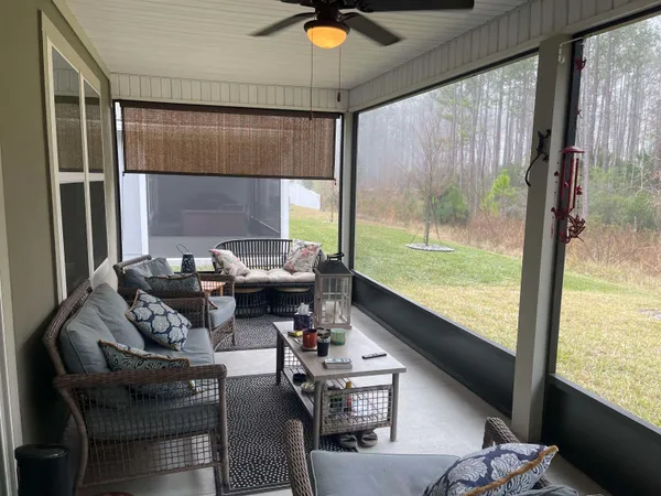 a living room with furniture and a window