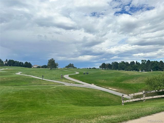 a view of a golf course with a garden